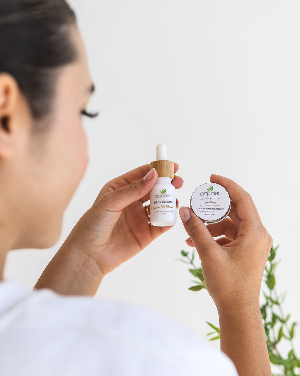 Preservative-free organic argan face serum in a glass dropper bottle